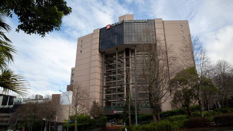 Woman charged over trying to escape from the Grand Millennium Hotel